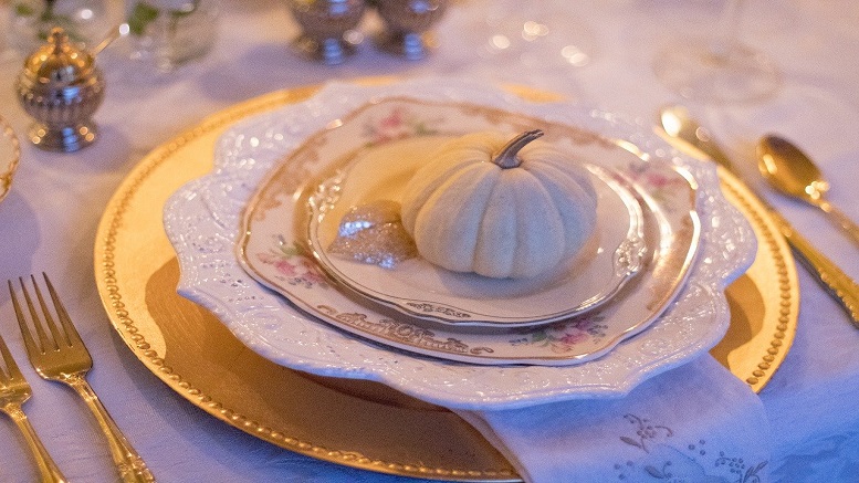 table laid for thanksgiving dinner with the family