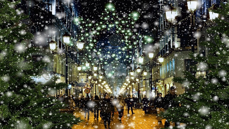 Last minute Christmas shopping in a high street when it is snowing