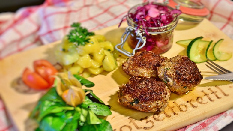 Moroccan lamb meatballs shown with garnish