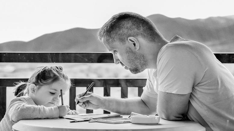 Dad and daughter showing that teaching kids at home is possible