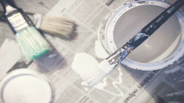 Paint and paintbrush to show home improvement ideas